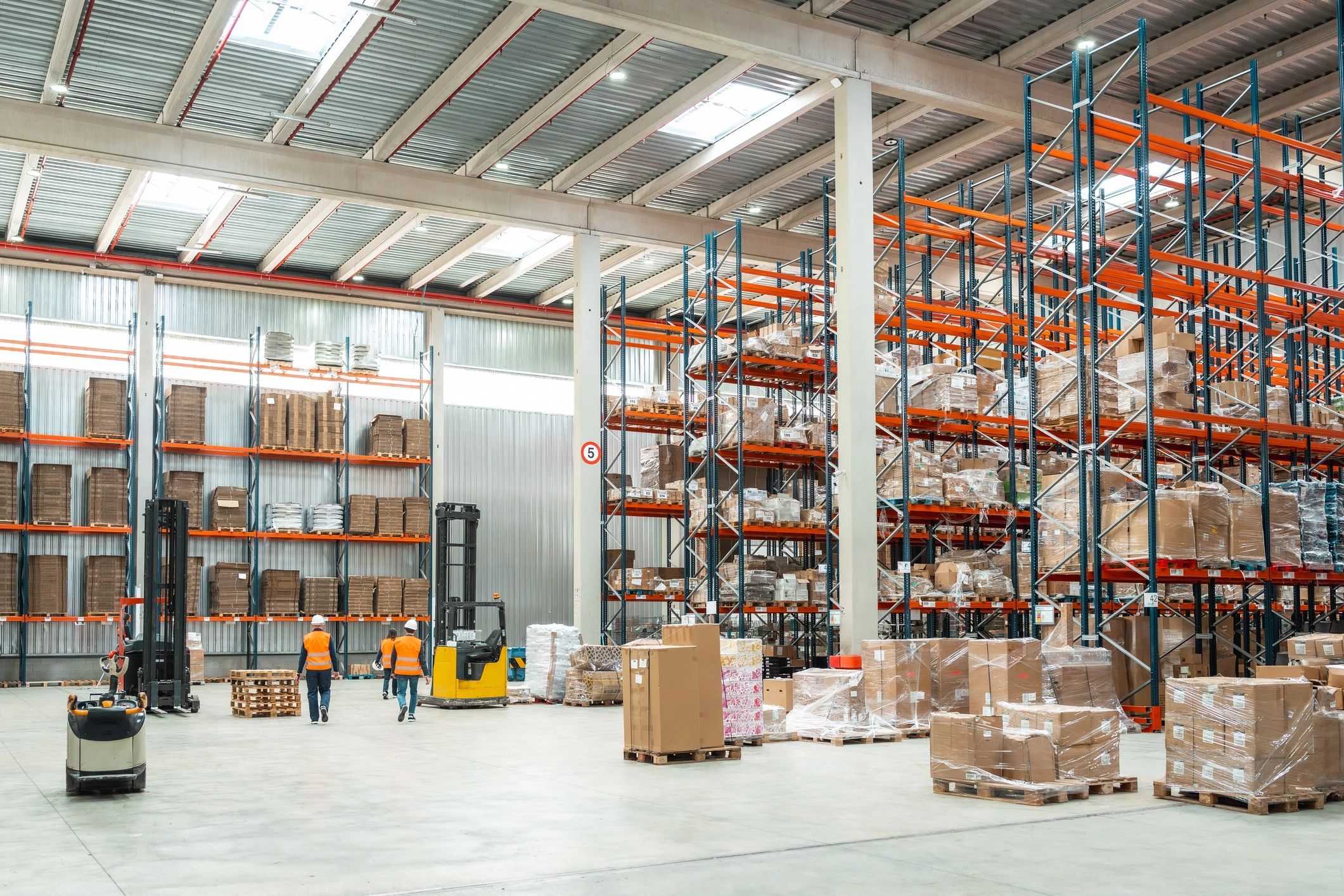 Logistics specialists preparing inventory for shipment in a distribution warehouse